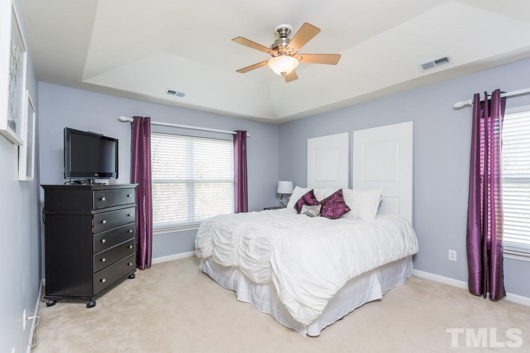 2629 Quarry Ridge Lane Raleigh, NC 27610 - Photo 8 of 12 a bedroom with a bed and a flat screen tv