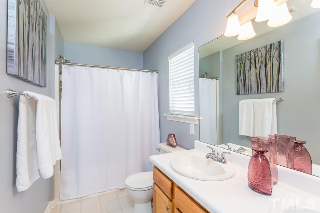 2629 Quarry Ridge Lane Raleigh, NC 27610 - Photo 9 of 12 a bathroom with a sink toilet and shower