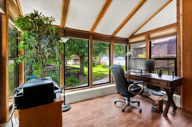 a workspace with furniture and a window