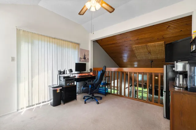 a workspace with furniture and window