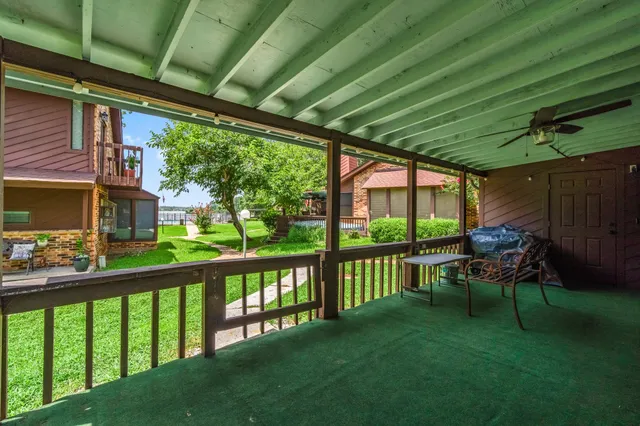 a view of a chair and tables in the deck