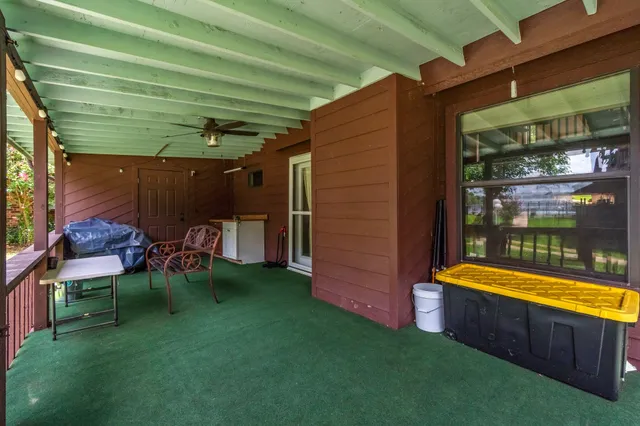 a view of a backyard with plants and a patio