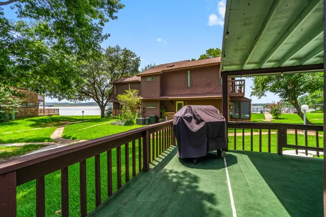 a view of a deck with a table and a chairs
