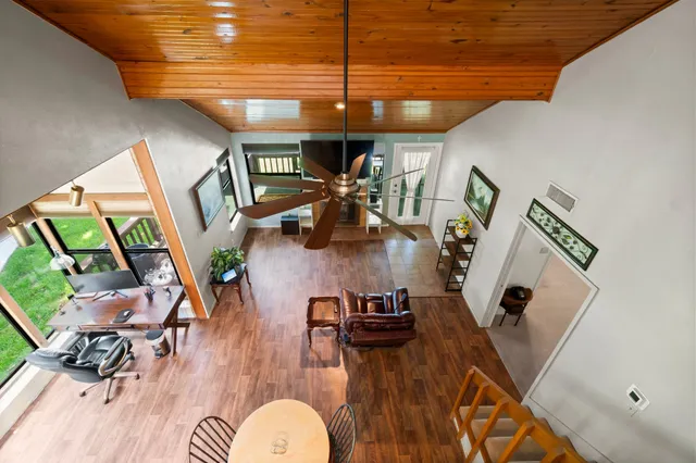 a view of a dining room with furniture wooden floor and chandelier