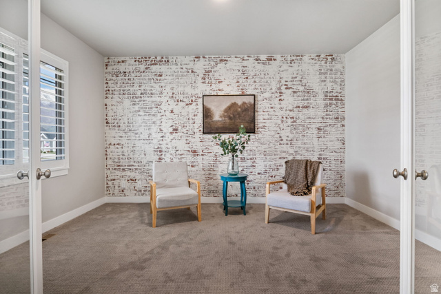 572 South Chamberlain Street Mapleton, UT 84664 - Photo 33 of 56 Sitting room featuring french doors, brick wall, carpet flooring, and an accent wall