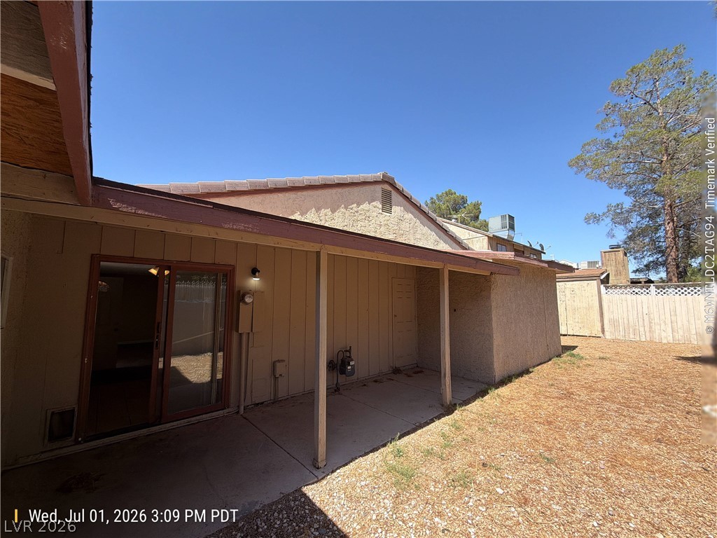 2313 Ragland Street Las Vegas, NV 89108 - Photo 10 of 11 A spacious backyard awaits, featuring a covered patio and solid fencing for comfort.