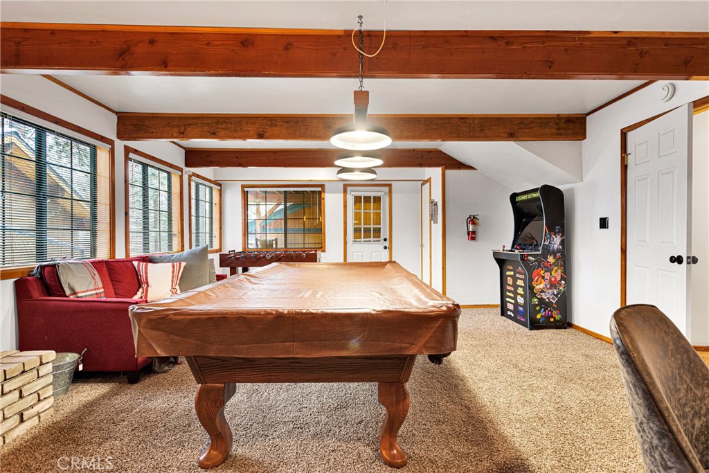 42363 Paramount Road Big Bear Lake, CA 92315 - Photo 32 of 58 a bed room with a bed and a chandelier