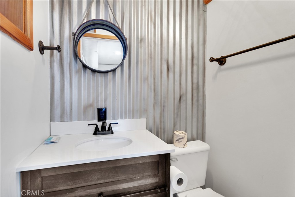 42363 Paramount Road Big Bear Lake, CA 92315 - Photo 34 of 58 a bathroom with a sink and a mirror