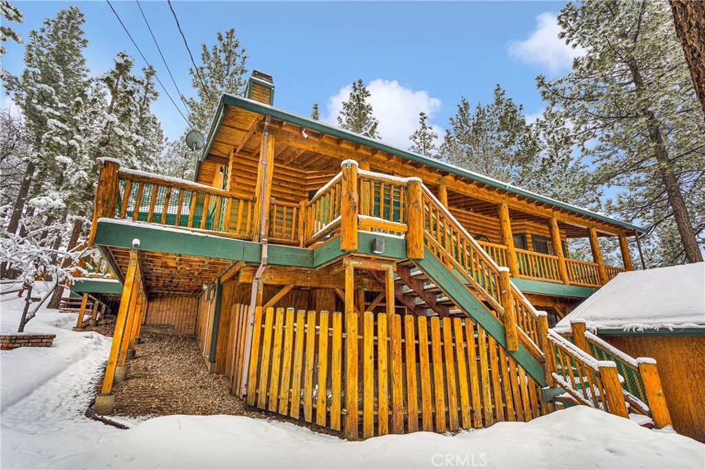 42363 Paramount Road Big Bear Lake, CA 92315 - Photo 4 of 58 a front view of a house with wooden stairs