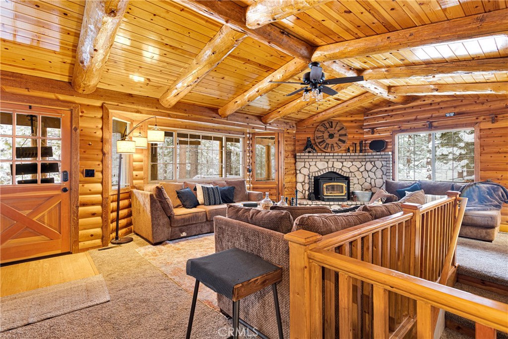 42363 Paramount Road Big Bear Lake, CA 92315 - Photo 7 of 58 a living room with furniture a fireplace and a flat screen tv
