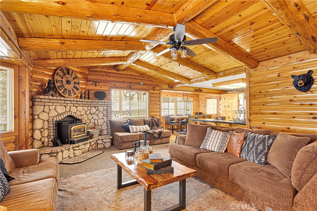 42363 Paramount Road Big Bear Lake, CA 92315 - Photo 9 of 58 a living room with furniture a fireplace and next to a window