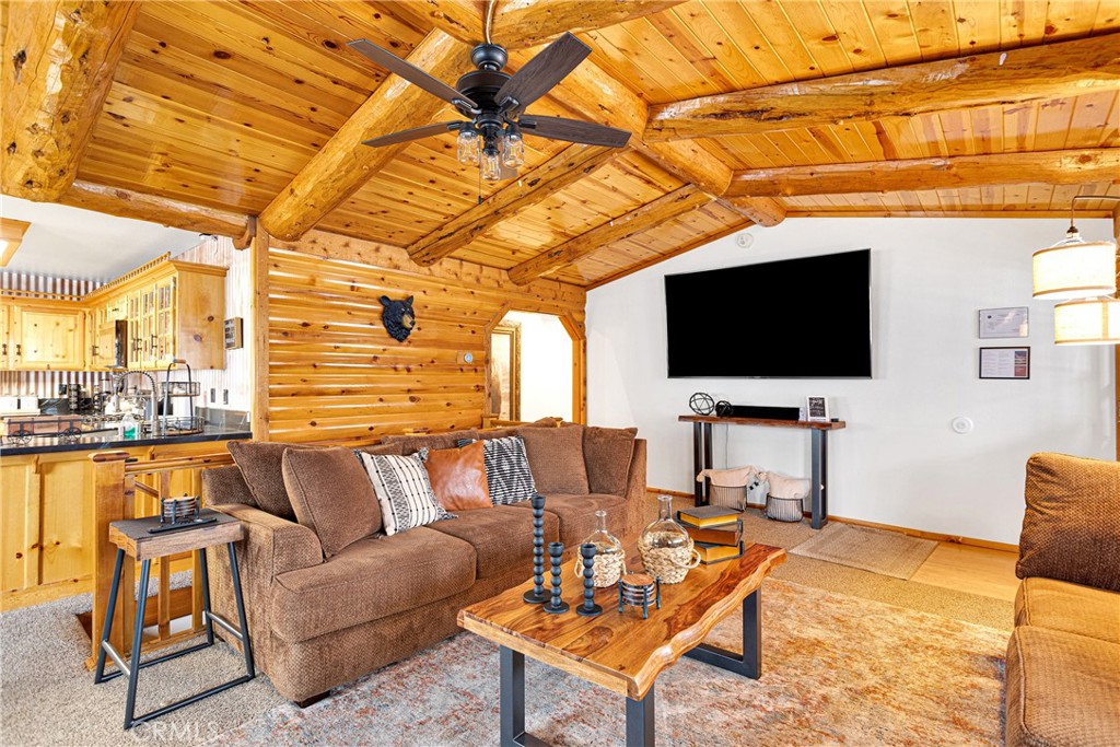 42363 Paramount Road Big Bear Lake, CA 92315 - Photo 10 of 58 a living room with patio furniture and a flat screen tv