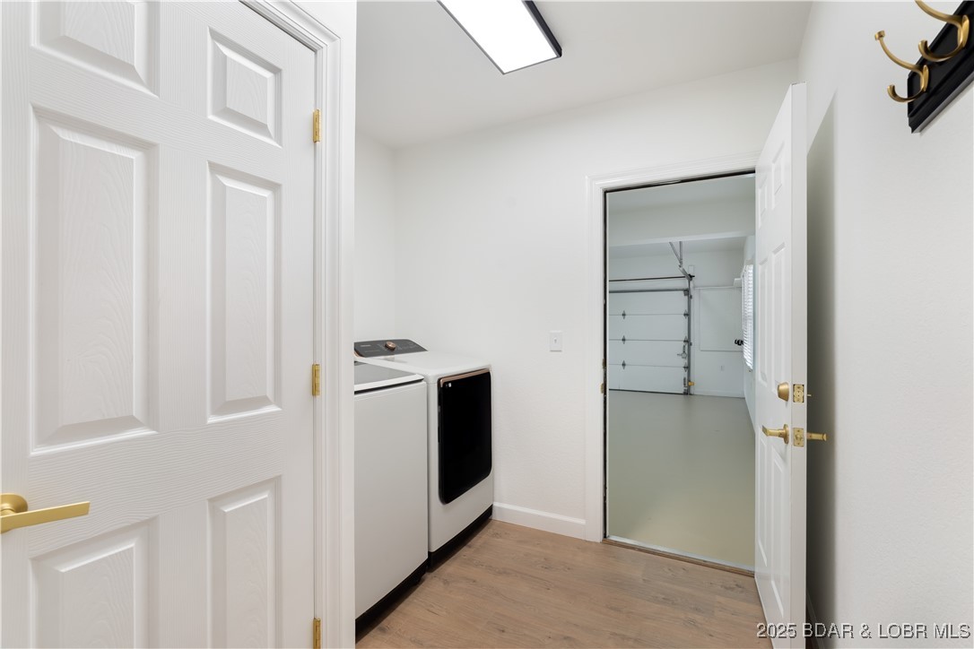 5488 Pebble Lane Osage Beach, MO 65065 - Photo 21 of 66 washer/dryer room and garage entrance