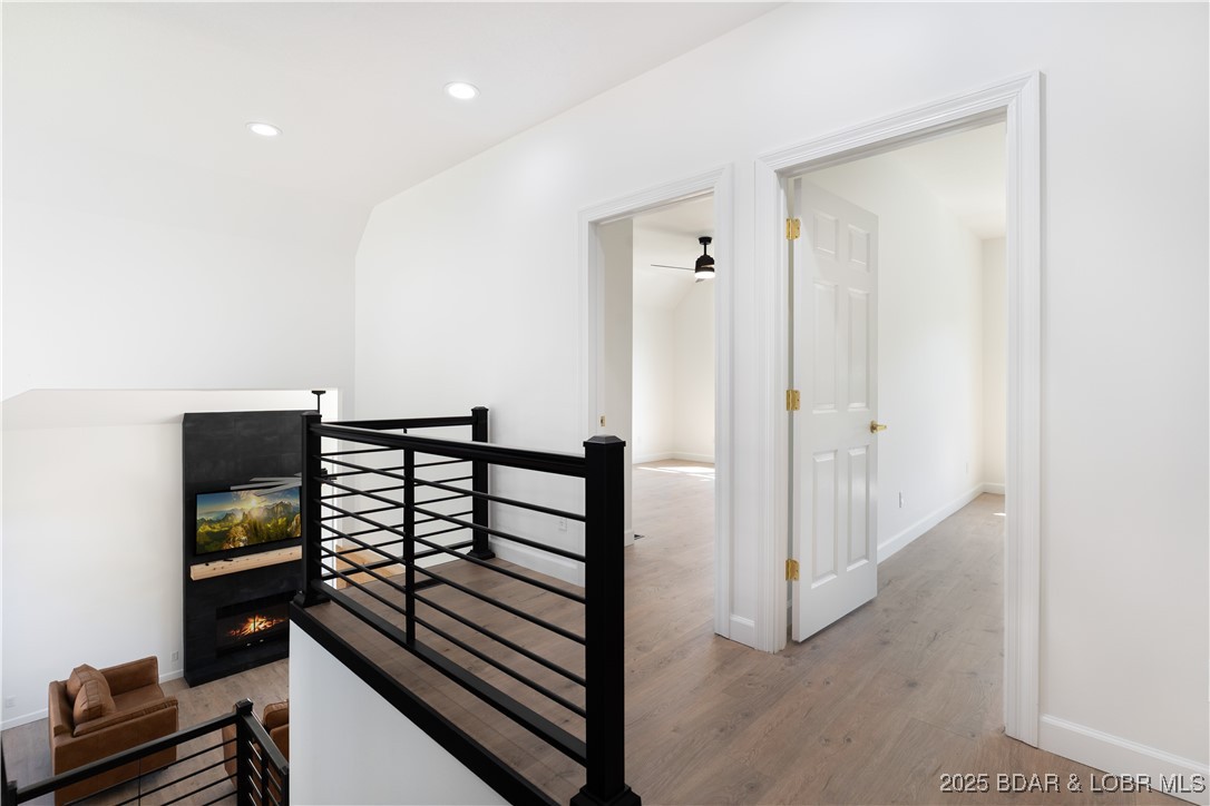 5488 Pebble Lane Osage Beach, MO 65065 - Photo 28 of 66 Transitioning to the guest bedrooms upstairs