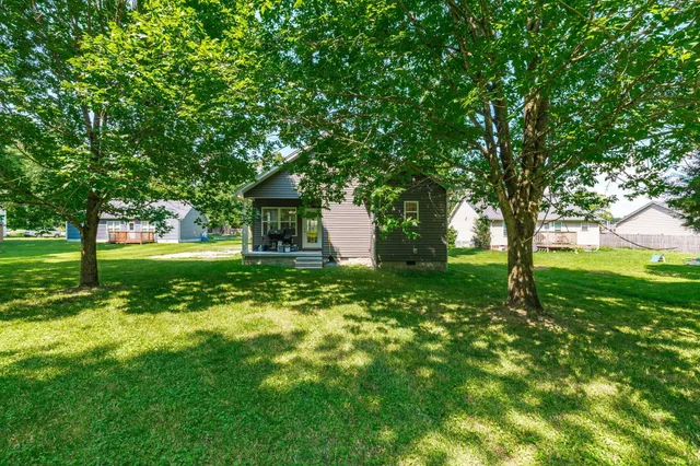 a backyard of a house with lots of green space