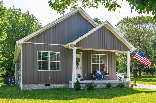 a front view of a house with garden