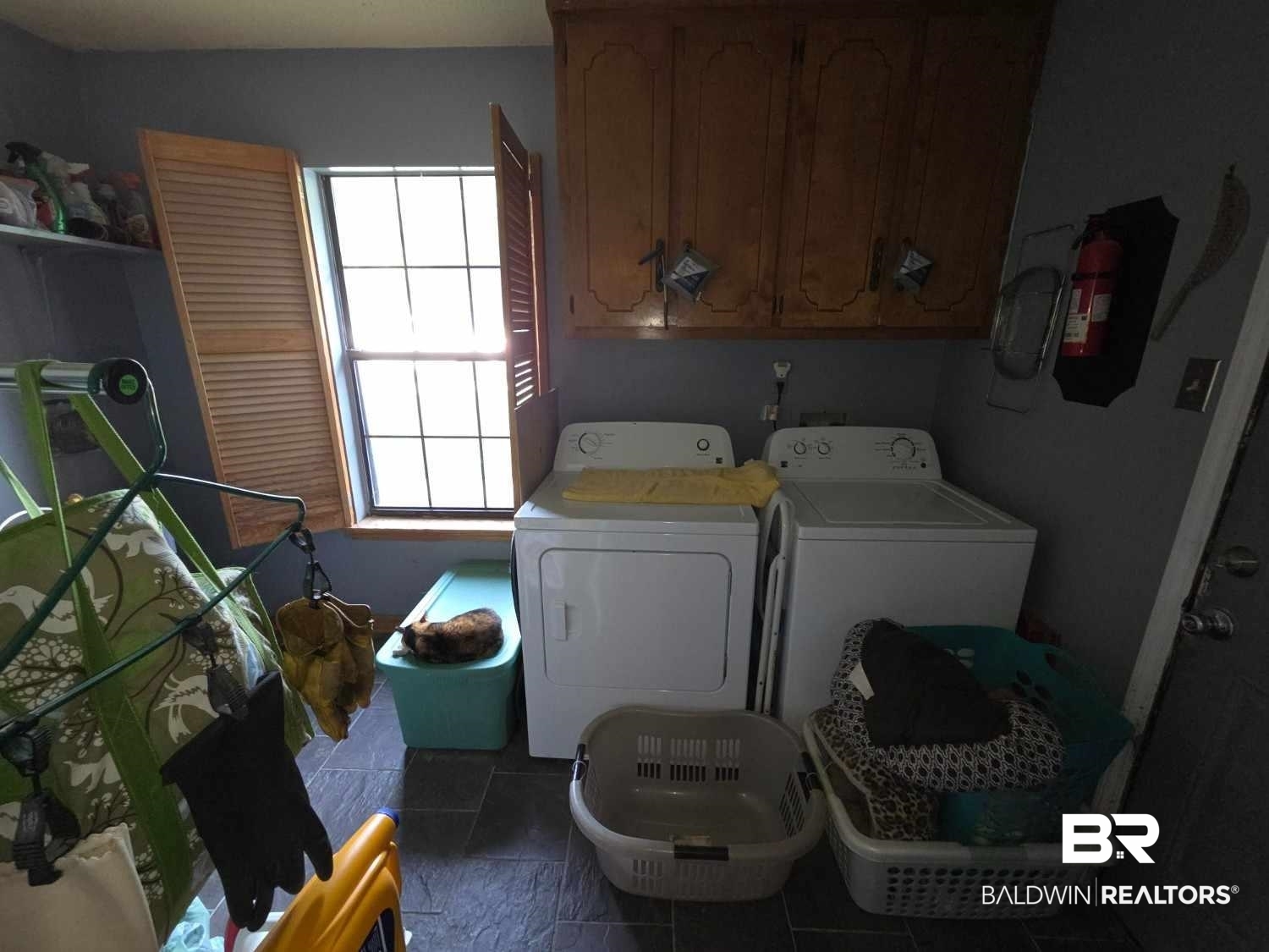 5120 West Celtic Drive Mobile, AL 36619 - Photo 22 of 27 Laundry area with separate washer and dryer and cabinet space