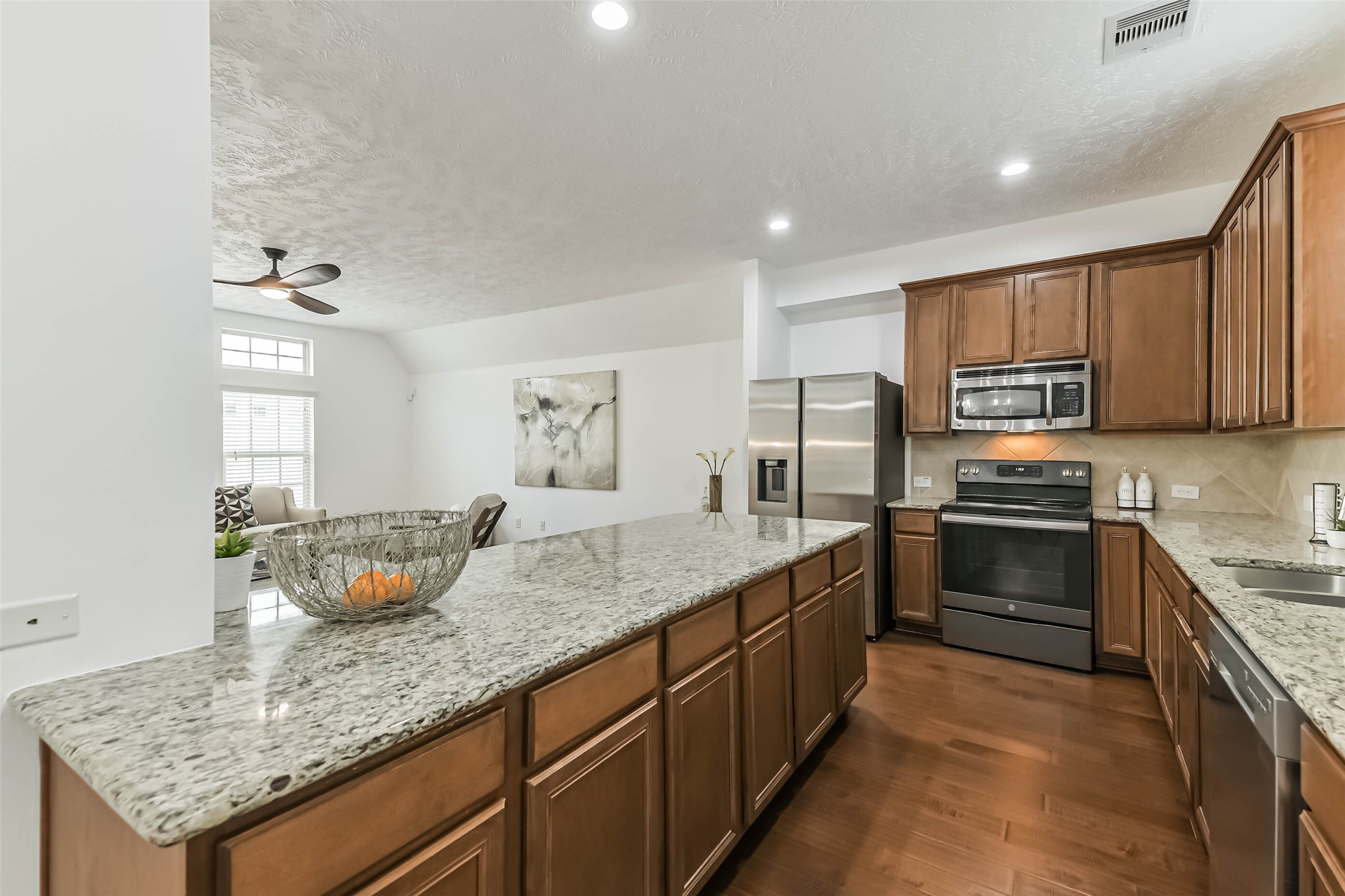 3324 Masters Point Drive Houston, TX 77091 - Photo 17 of 40 a kitchen with stainless steel appliances granite countertop a sink dishwasher stove and oven