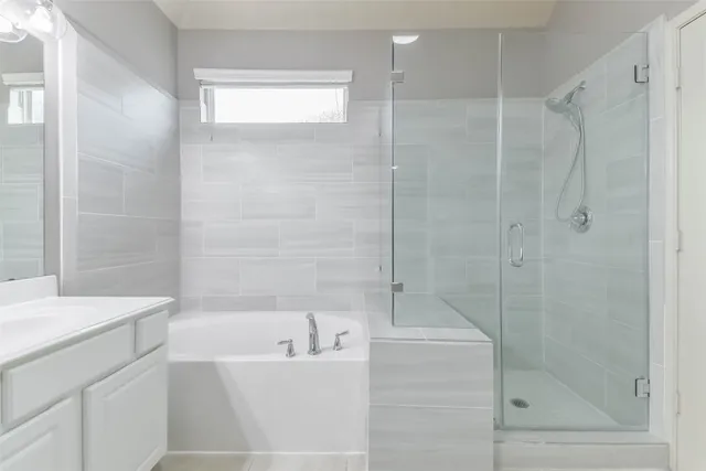 a bathroom with a bathtub and a shower