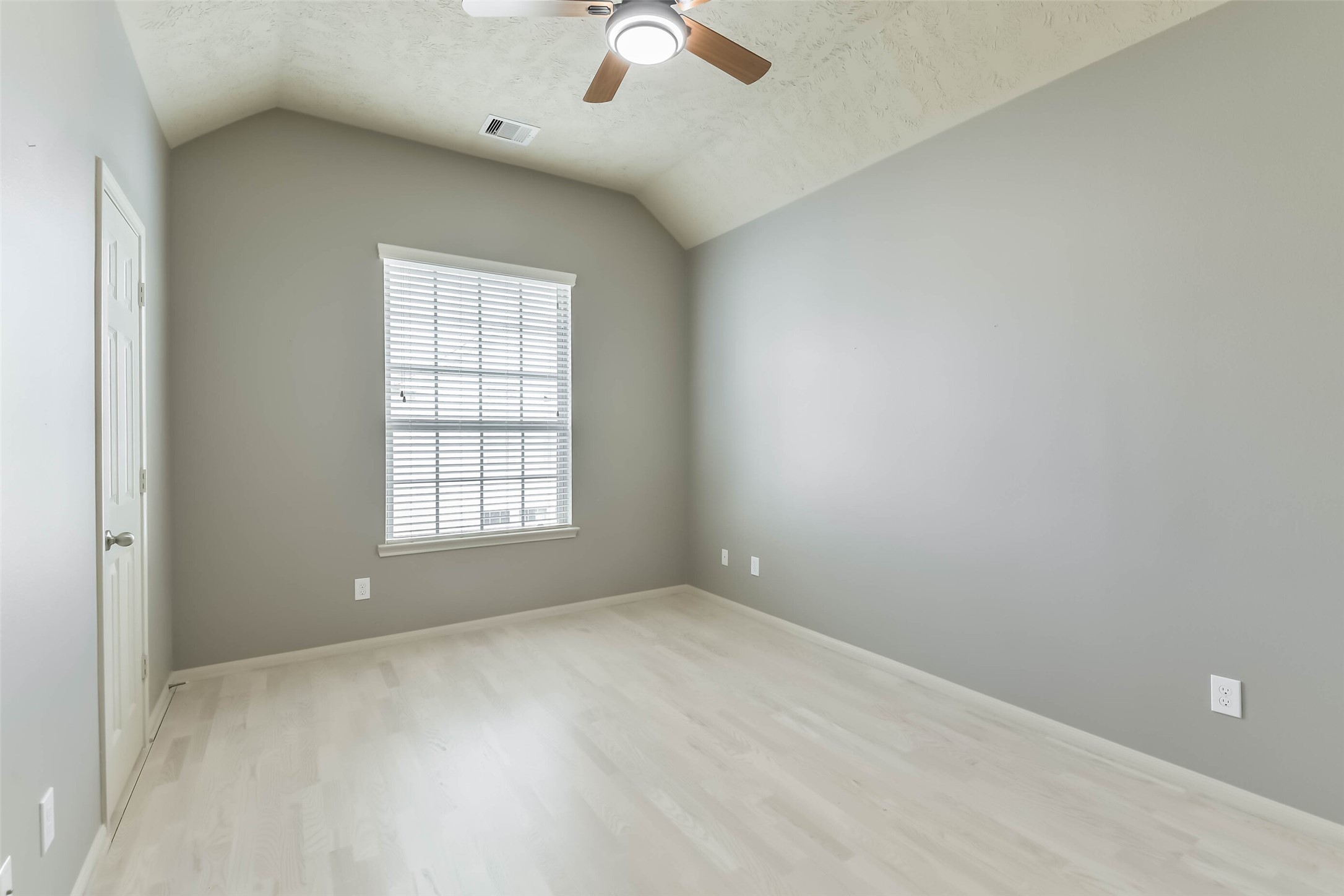 3324 Masters Point Drive Houston, TX 77091 - Photo 31 of 40 wooden floor in an empty room with a window