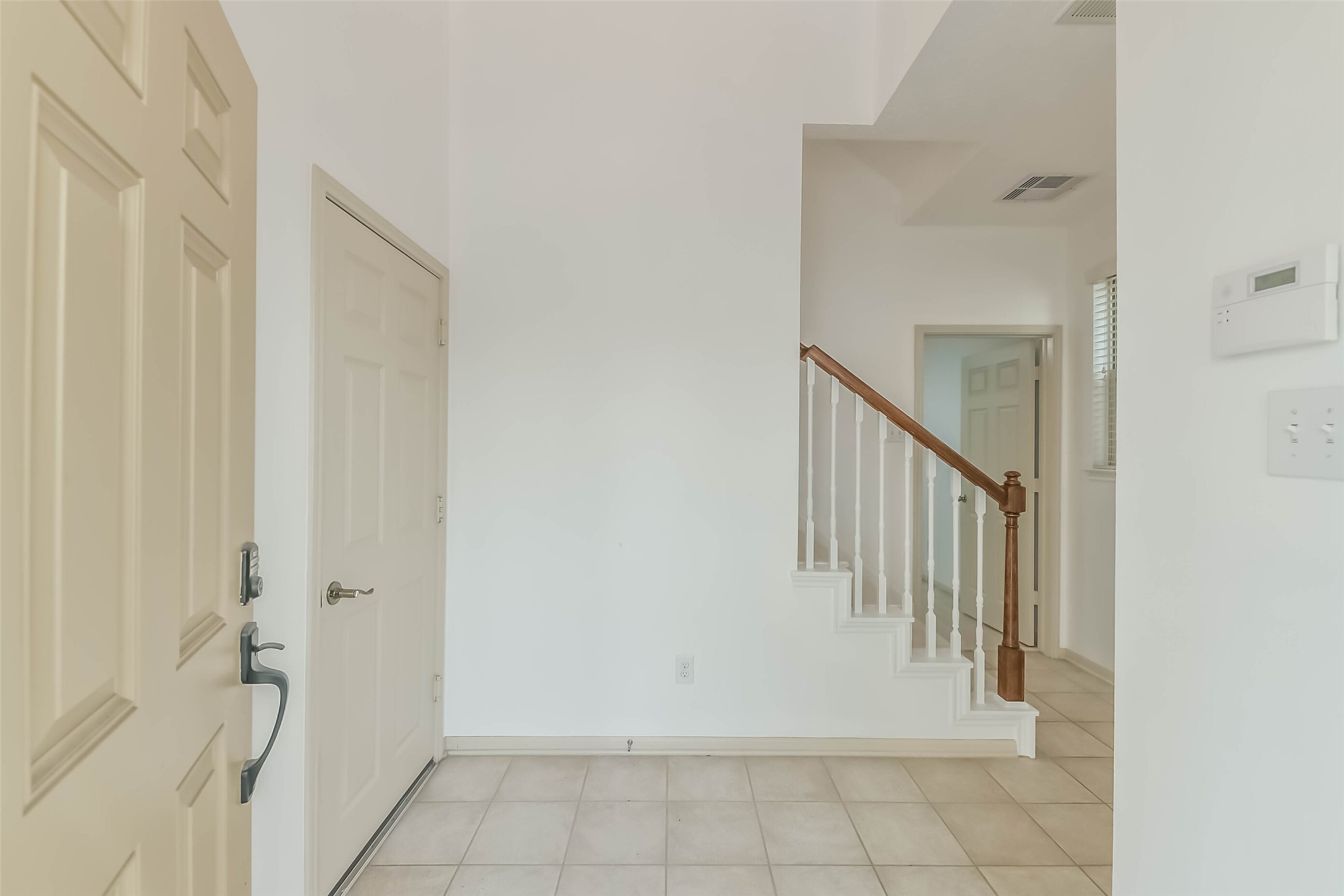 3324 Masters Point Drive Houston, TX 77091 - Photo 6 of 40 a view of a hallway with a white door and a white door