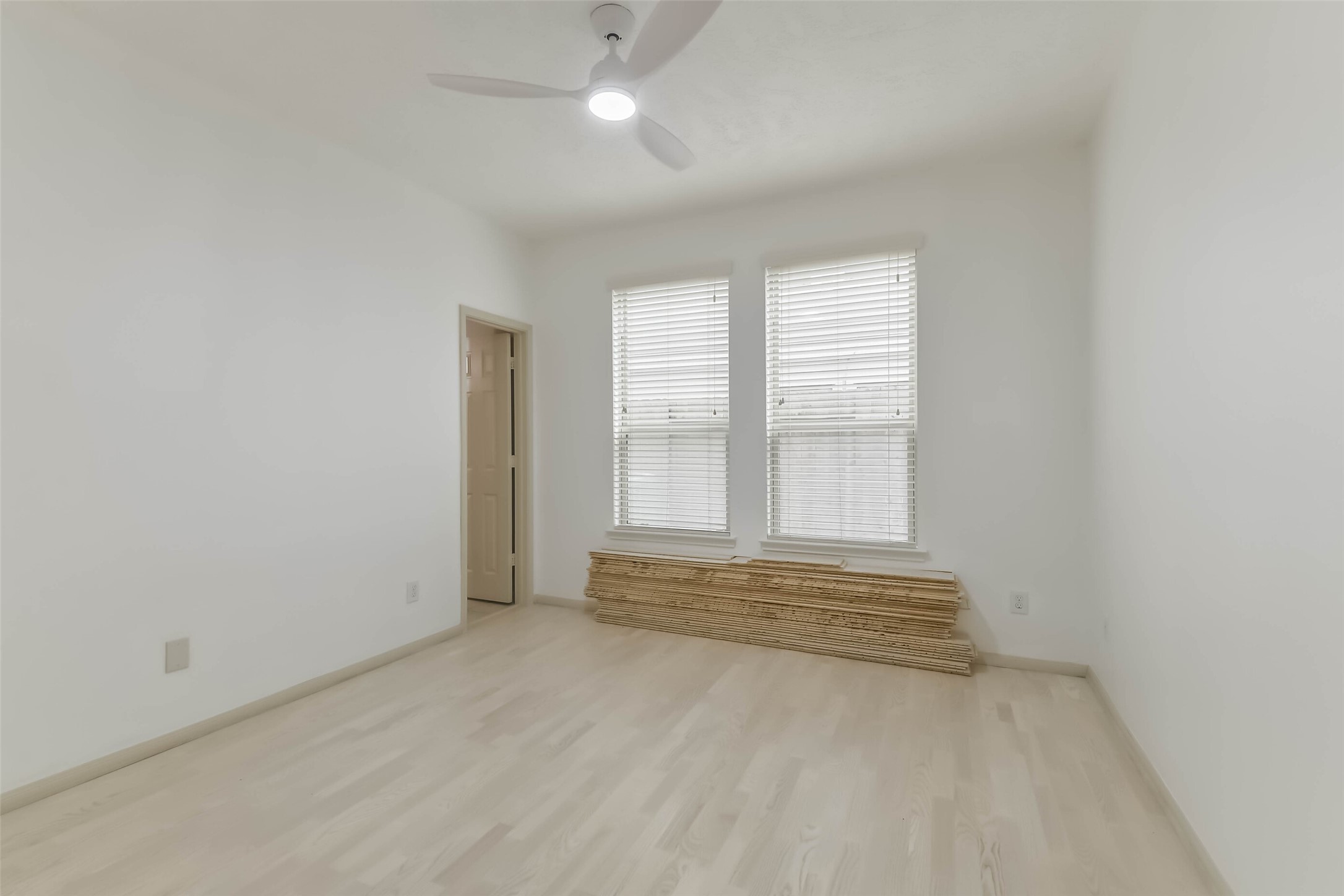 3324 Masters Point Drive Houston, TX 77091 - Photo 8 of 40 an empty room with a empty space and windows