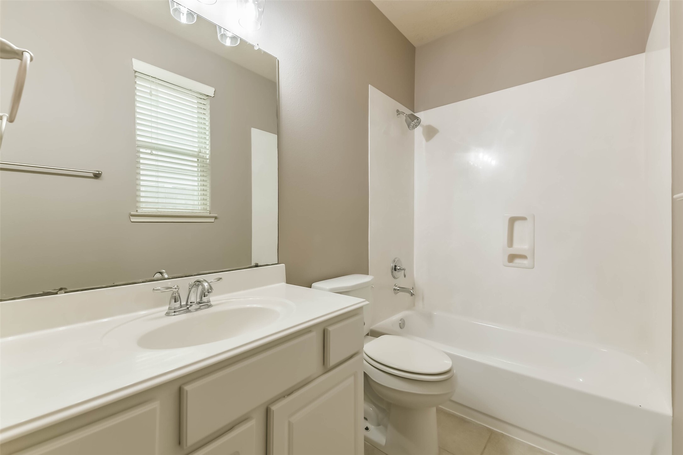 3324 Masters Point Drive Houston, TX 77091 - Photo 9 of 40 a bathroom with a sink a toilet and shower
