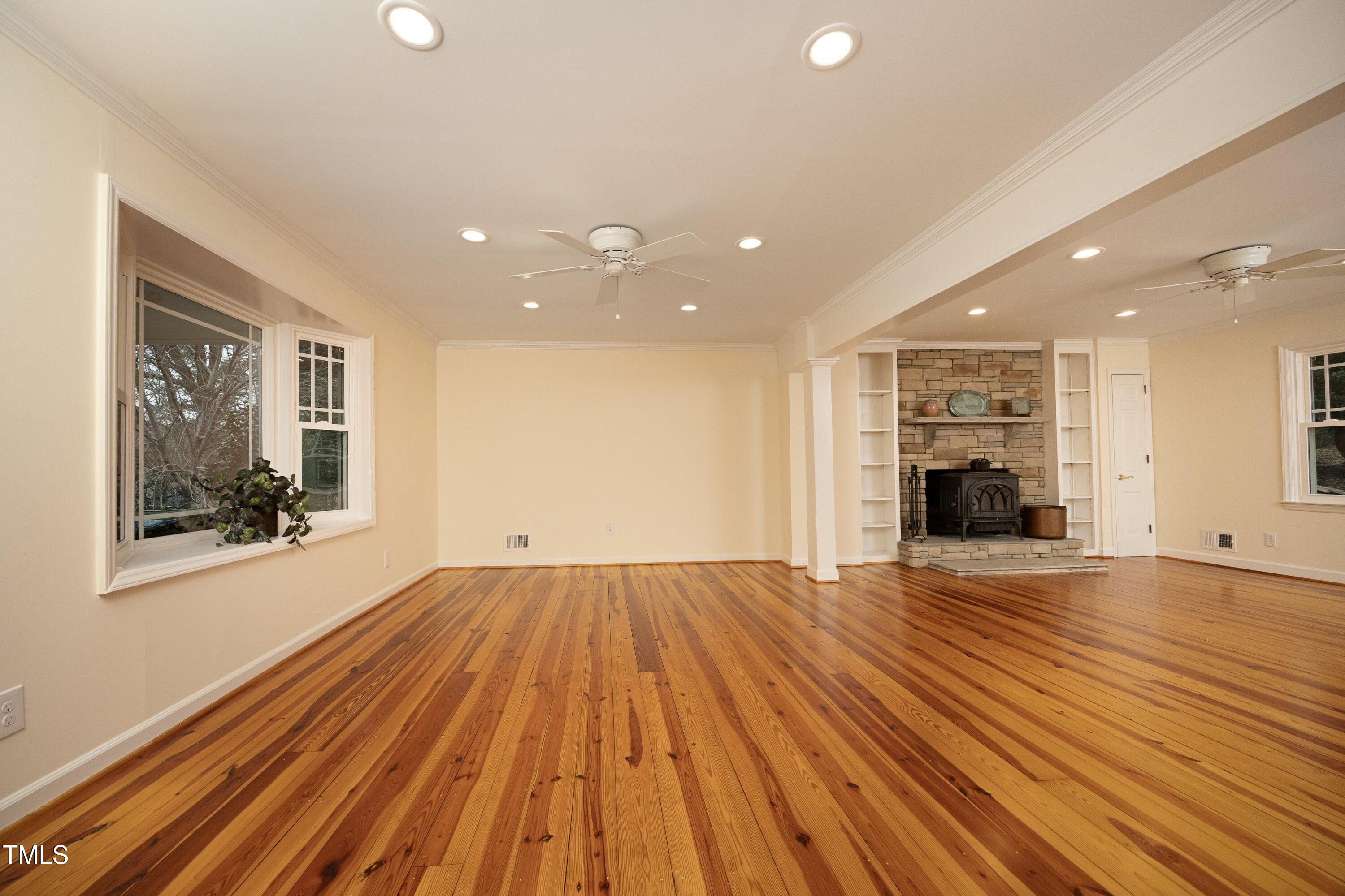 4616 Oak Park Road Raleigh, NC 27612 - Photo 11 of 63 Gorgeous and rich heart of pine flooring throughout first floor. Bay window in living room area