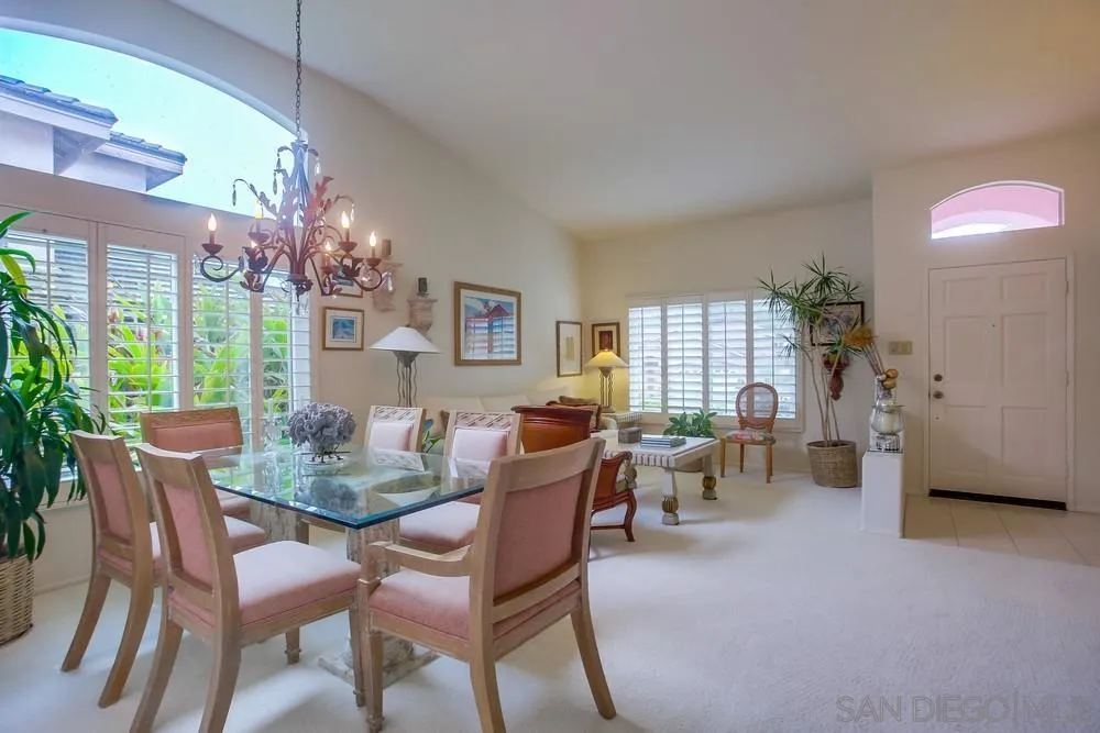 793 Poppy Road San Marcos, CA 92078 - Photo 12 of 38 a view of a dining room with furniture wooden floor and chandelier
