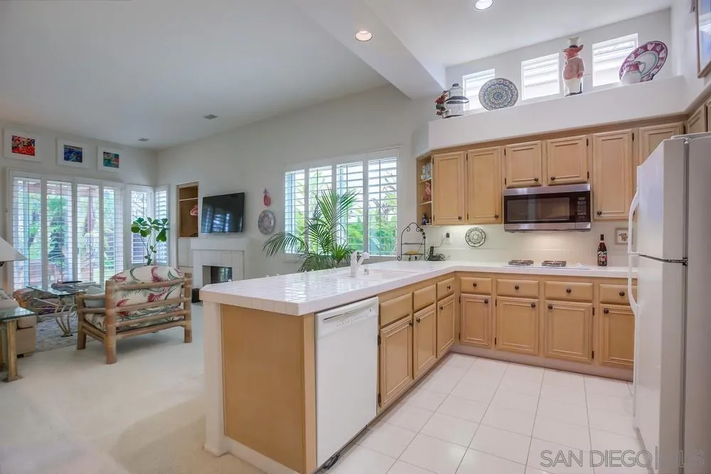 793 Poppy Road San Marcos, CA 92078 - Photo 14 of 38 a kitchen with sink cabinets and microwave