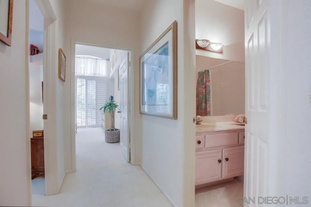 793 Poppy Road San Marcos, CA 92078 - Photo 20 of 38 a view of hallway with livingroom and wooden floor