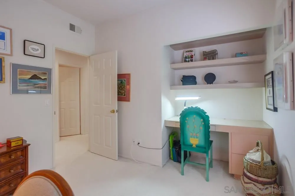 793 Poppy Road San Marcos, CA 92078 - Photo 25 of 38 a view of a hallway with workspace and toys