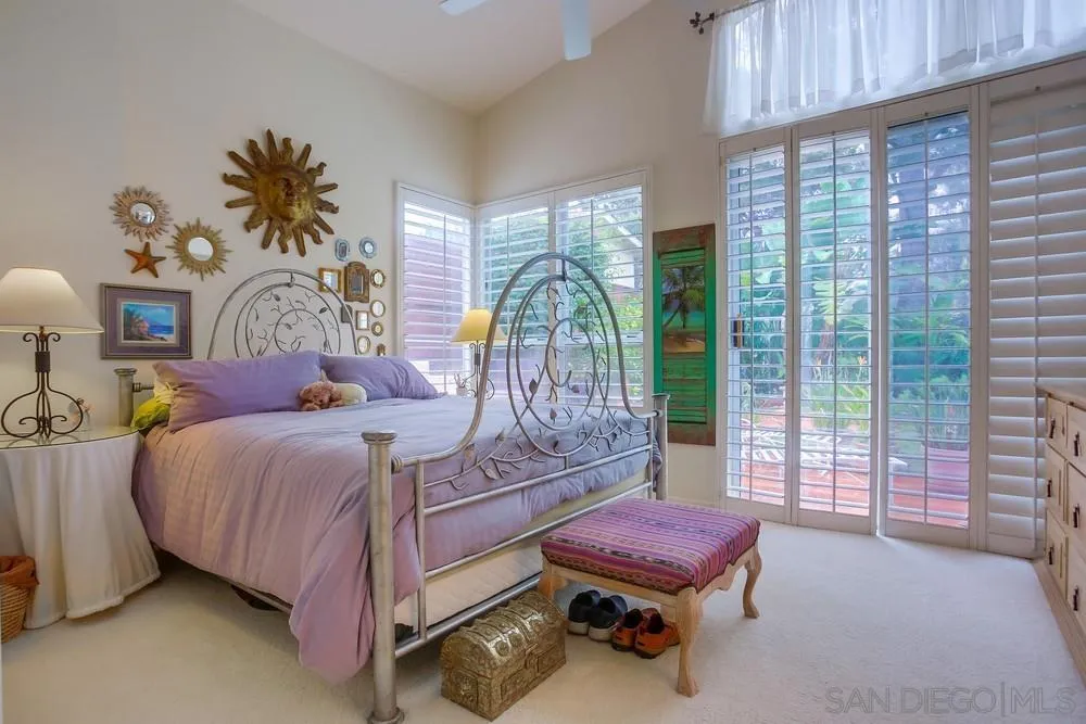 793 Poppy Road San Marcos, CA 92078 - Photo 26 of 38 a bedroom with a bed and large window
