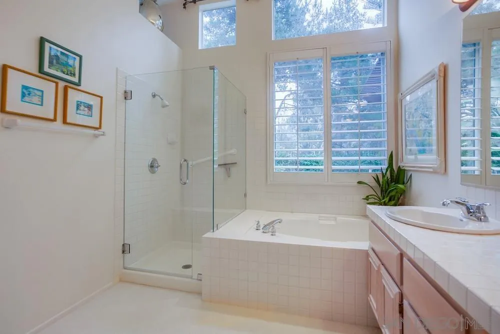 793 Poppy Road San Marcos, CA 92078 - Photo 31 of 38 a bathroom with a bathtub and a sink