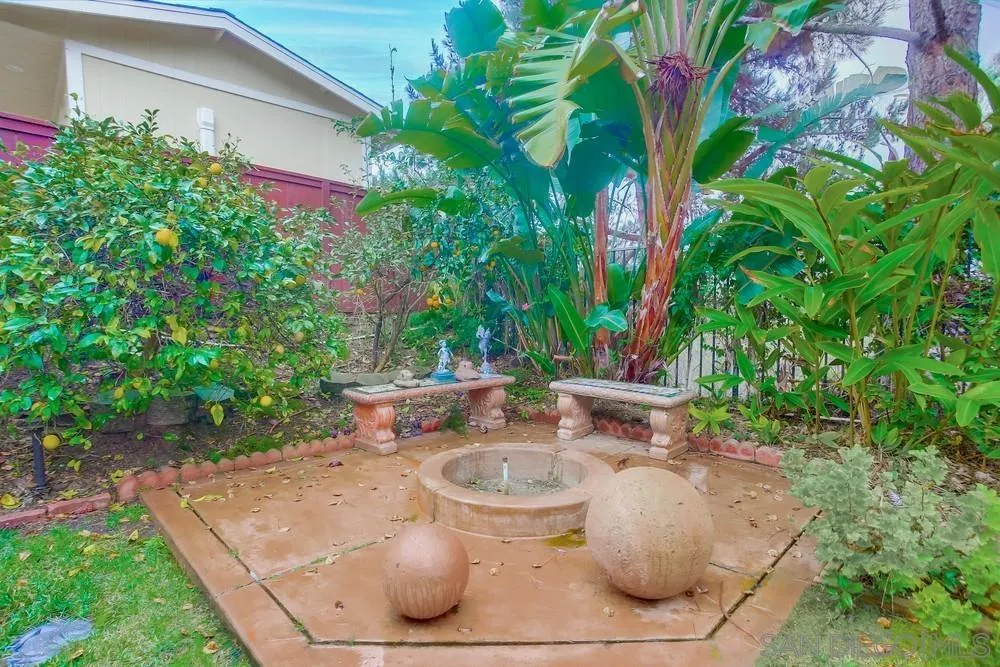 793 Poppy Road San Marcos, CA 92078 - Photo 36 of 38 a view of a backyard with table and chairs potted plants