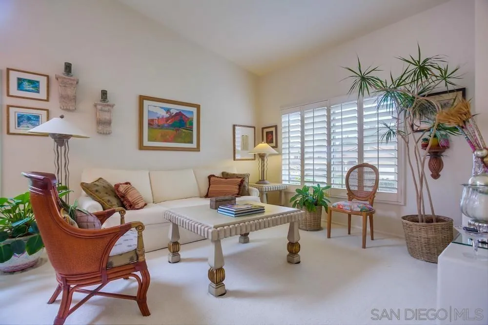 793 Poppy Road San Marcos, CA 92078 - Photo 5 of 38 a living room with furniture a lamp and a potted plant