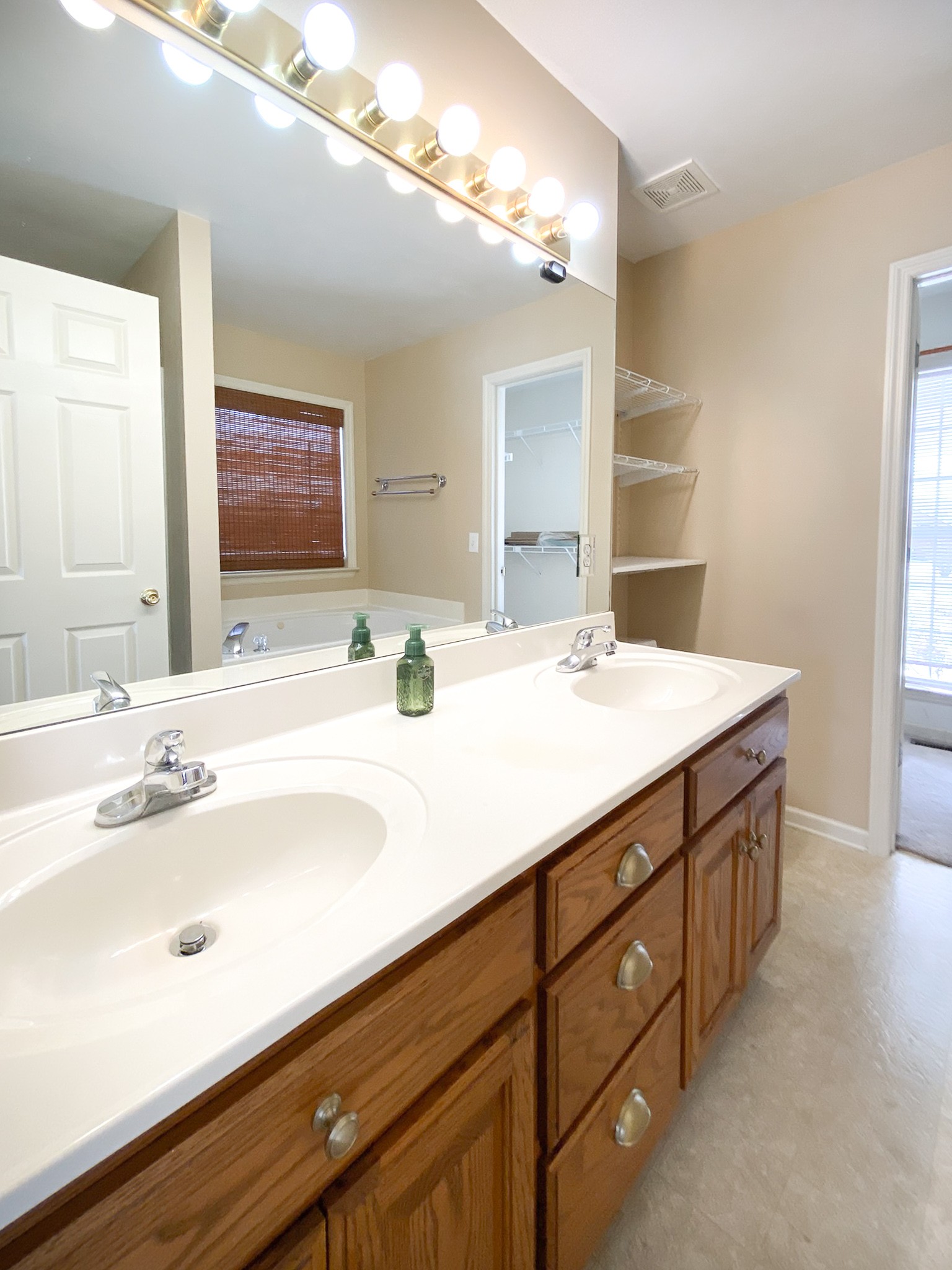 215 Falcon Drive Manchester, TN 37355 - Photo 12 of 25 a bathroom with a double vanity sink and a mirror