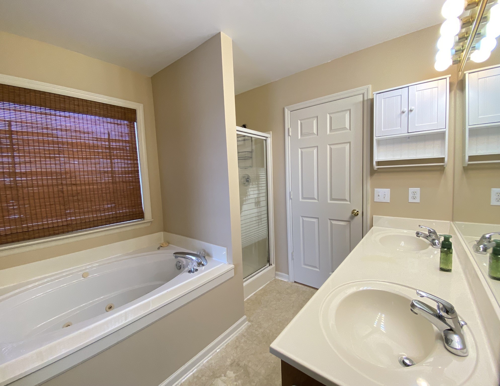 215 Falcon Drive Manchester, TN 37355 - Photo 13 of 25 a bathroom with a tub and a sink