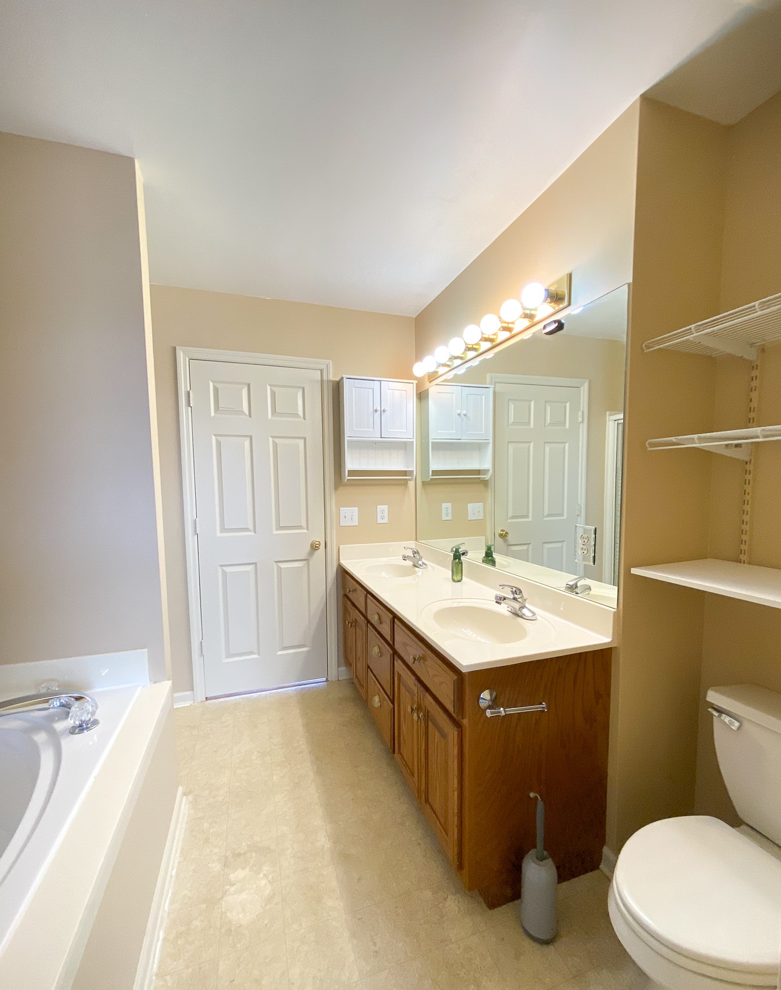215 Falcon Drive Manchester, TN 37355 - Photo 16 of 25 a bathroom with a sink a toilet and mirror