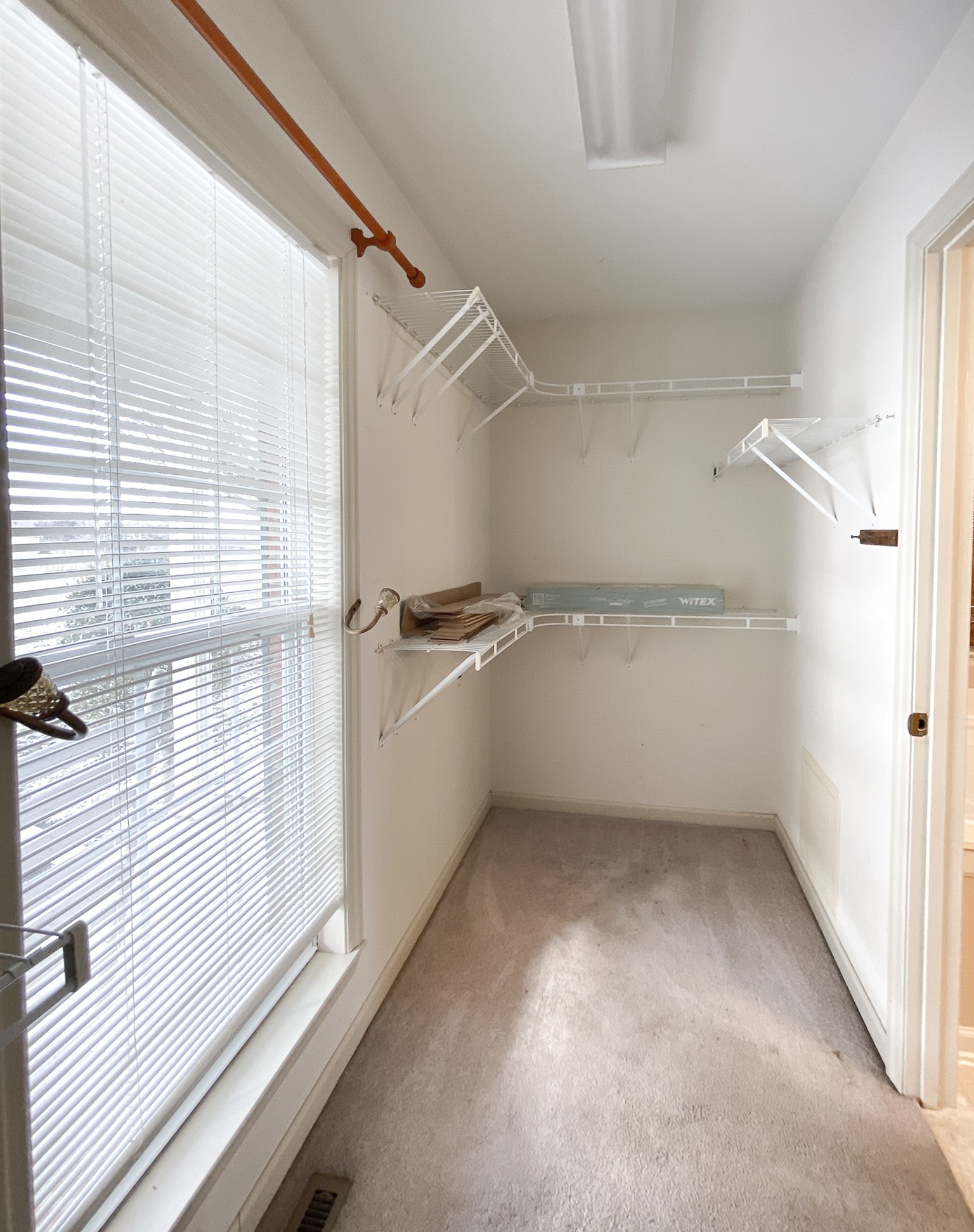 215 Falcon Drive Manchester, TN 37355 - Photo 18 of 25 a view of a room with racks on the wall
