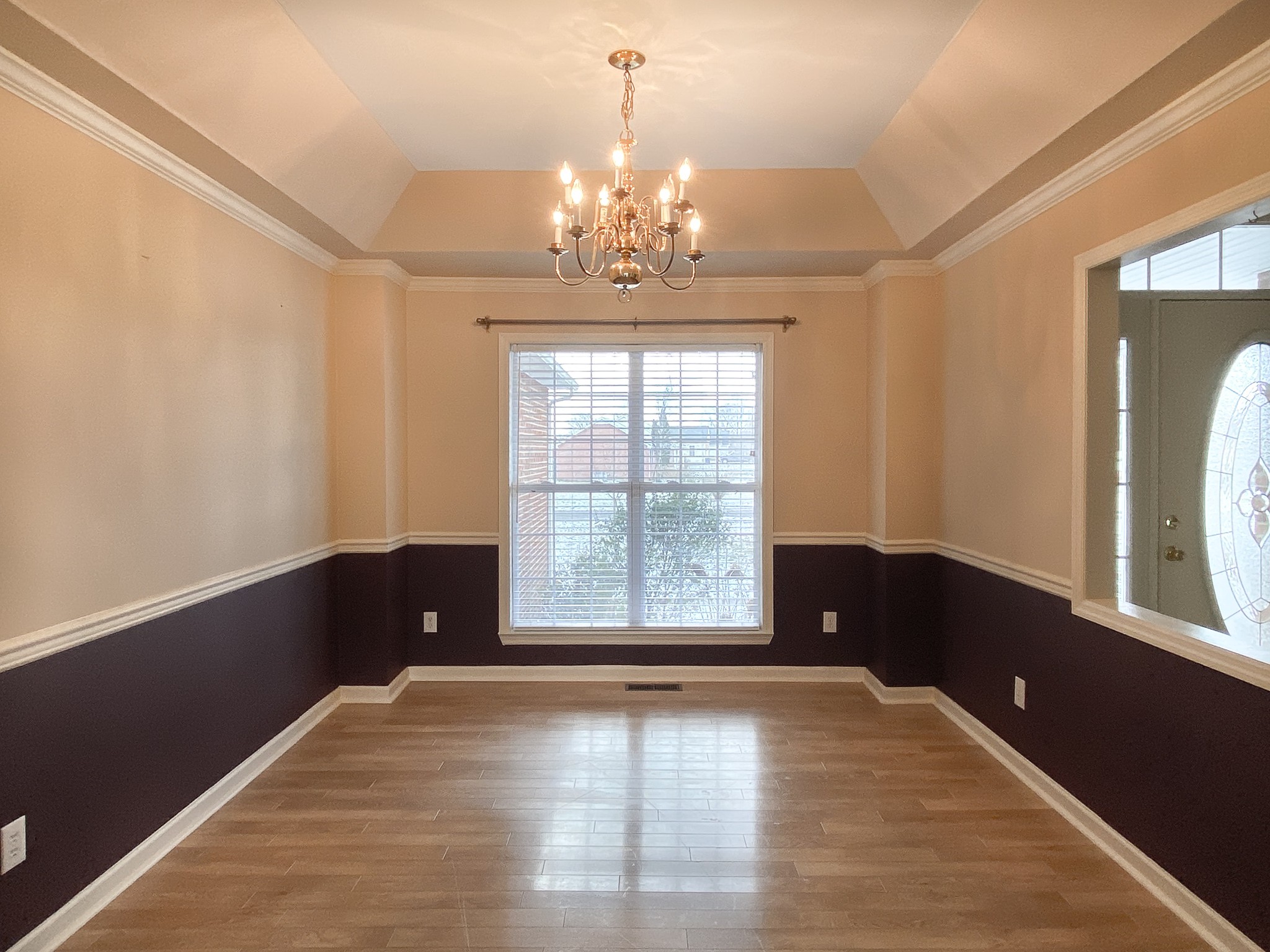 215 Falcon Drive Manchester, TN 37355 - Photo 5 of 25 a view of an empty room with a window and wooden floor