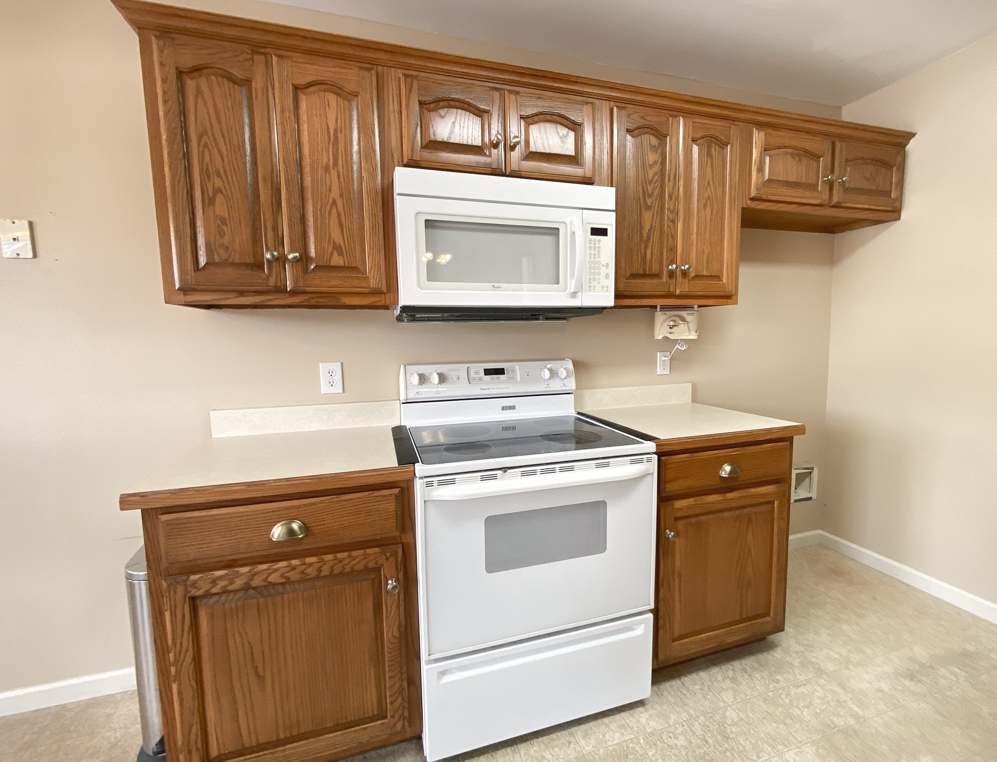 215 Falcon Drive Manchester, TN 37355 - Photo 8 of 25 a kitchen with stainless steel appliances granite countertop white cabinets a stove a sink and dishwasher