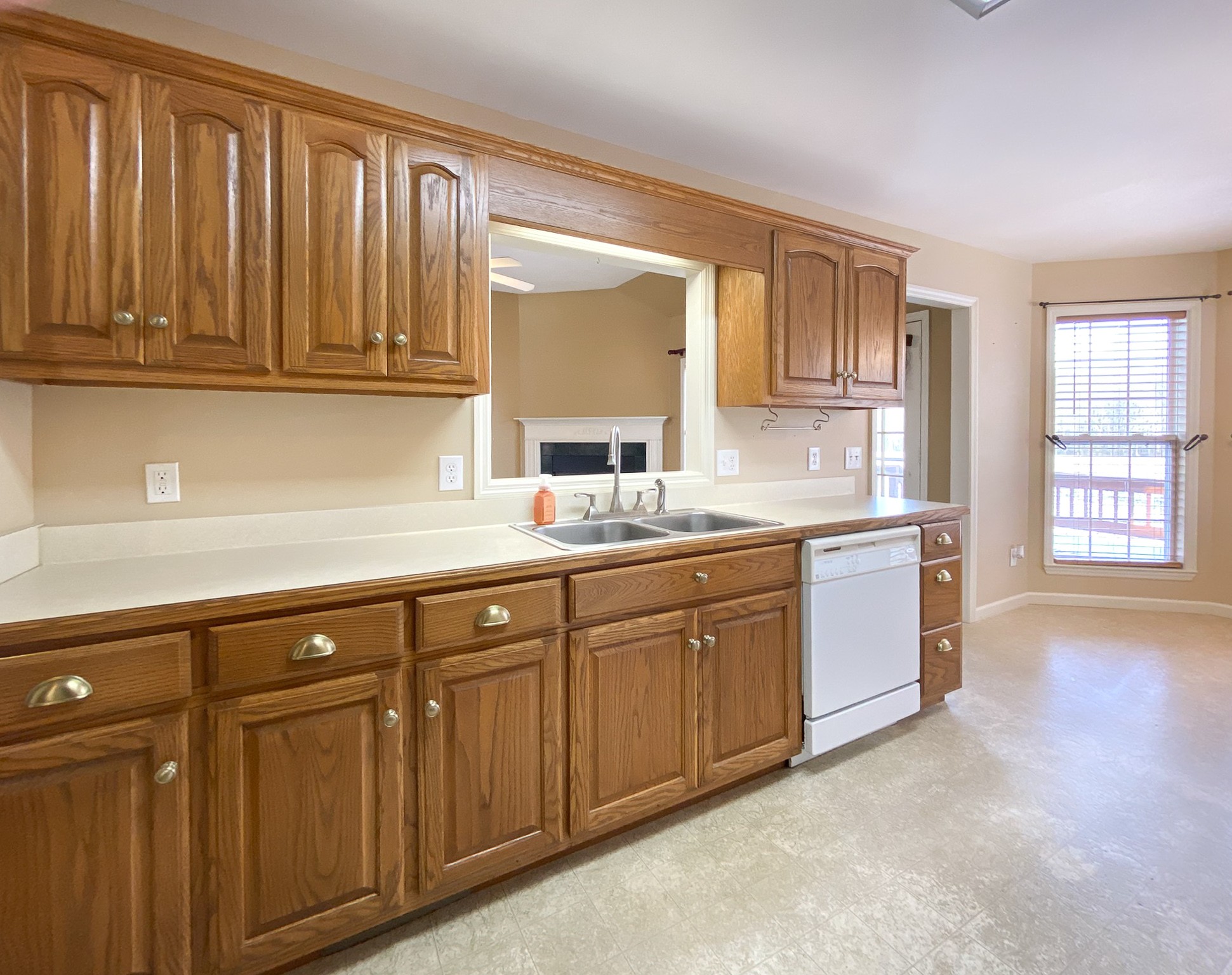 215 Falcon Drive Manchester, TN 37355 - Photo 9 of 25 a kitchen with granite countertop white cabinets sink and window