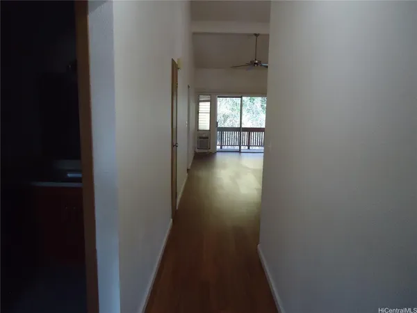 a view of an empty room with a window