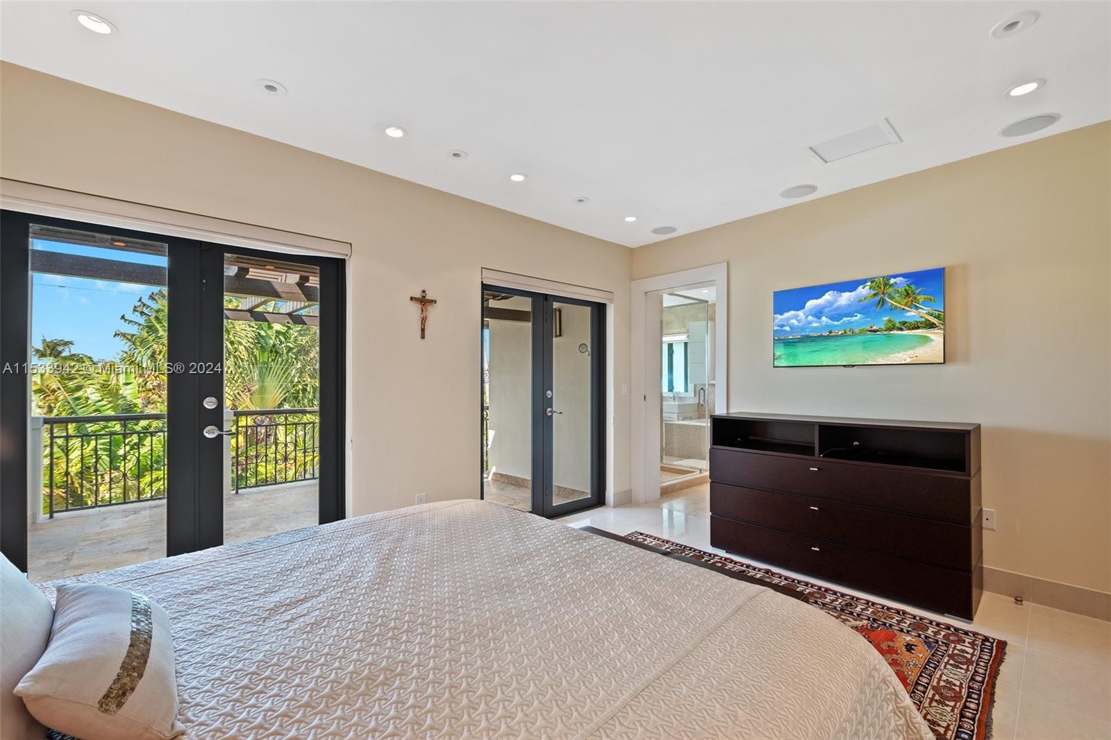 422 Fernwood Road, Unit 422 Key Biscayne, FL 33149 - Photo 16 of 25 a bedroom with a bed and dresser