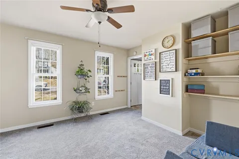 a view of livingroom with furniture window and wooden floor