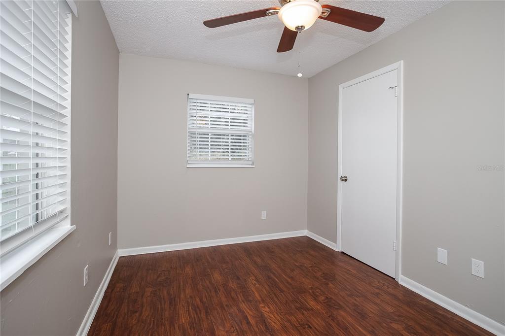 2015 Jones Avenue Sanford, FL 32771 - Photo 11 of 16 a view of an empty room with wooden floor and a window