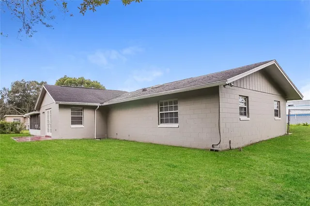a backyard of a house with lots of green space