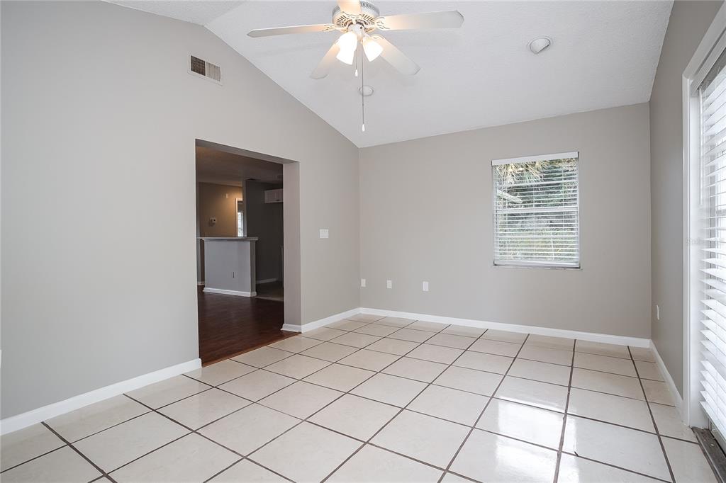 2015 Jones Avenue Sanford, FL 32771 - Photo 5 of 16 a view of an empty room with window and chandelier fan