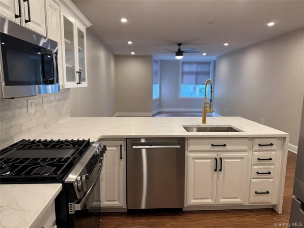 a kitchen with a stove and a microwave